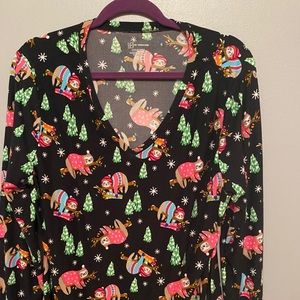 Long sleeve Christmas sloth shirt.